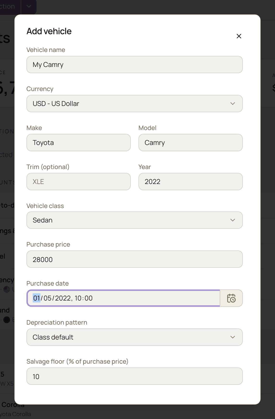 The Add vehicle form filled in for a 2022 Toyota Camry, with the vehicle name, currency, make, model, year, purchase price of 28,000 and purchase date fields, plus the vehicle class, depreciation pattern and salvage floor fields below.